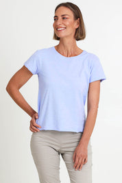 Model Riinar wearing size 10 of the Intersection Cotton Tee – Sky in colour Sky, in a cropped view