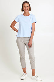 Model Riinar wearing size 10 of the Intersection Tee – Sky in colour Sky, from the front