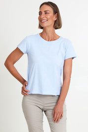 Model Riinar wearing size 10 of the Intersection Tee – Sky in colour Sky, from the front