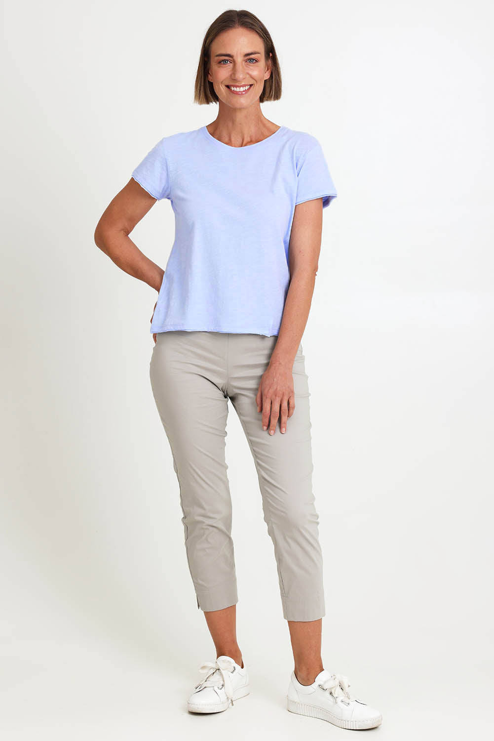 Model Riinar wearing size 10 of the Intersection Cotton Tee – Sky in colour Sky, from the front