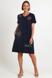 Model Riinar wearing size 10 of the Bright Spot Dress – Truenavy in colour Truenavy, from the front