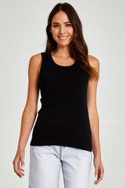 Model Madeline wearing size 10 of the Esme Cotton Tank in colour Black (Black), from the front, cropped image