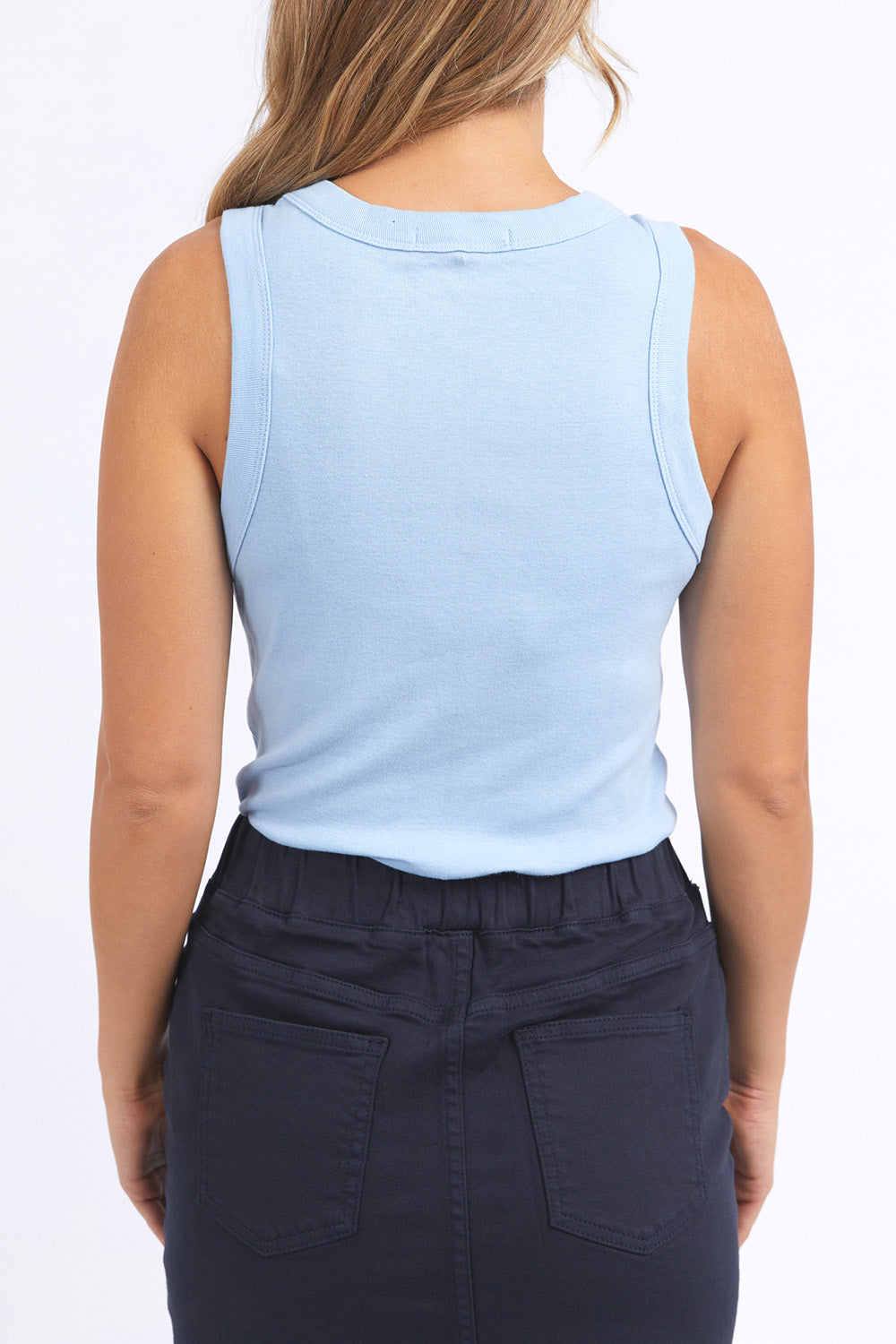 A model wearing the Esme Cotton Tank in colour Bluebelle (Blue), from the back