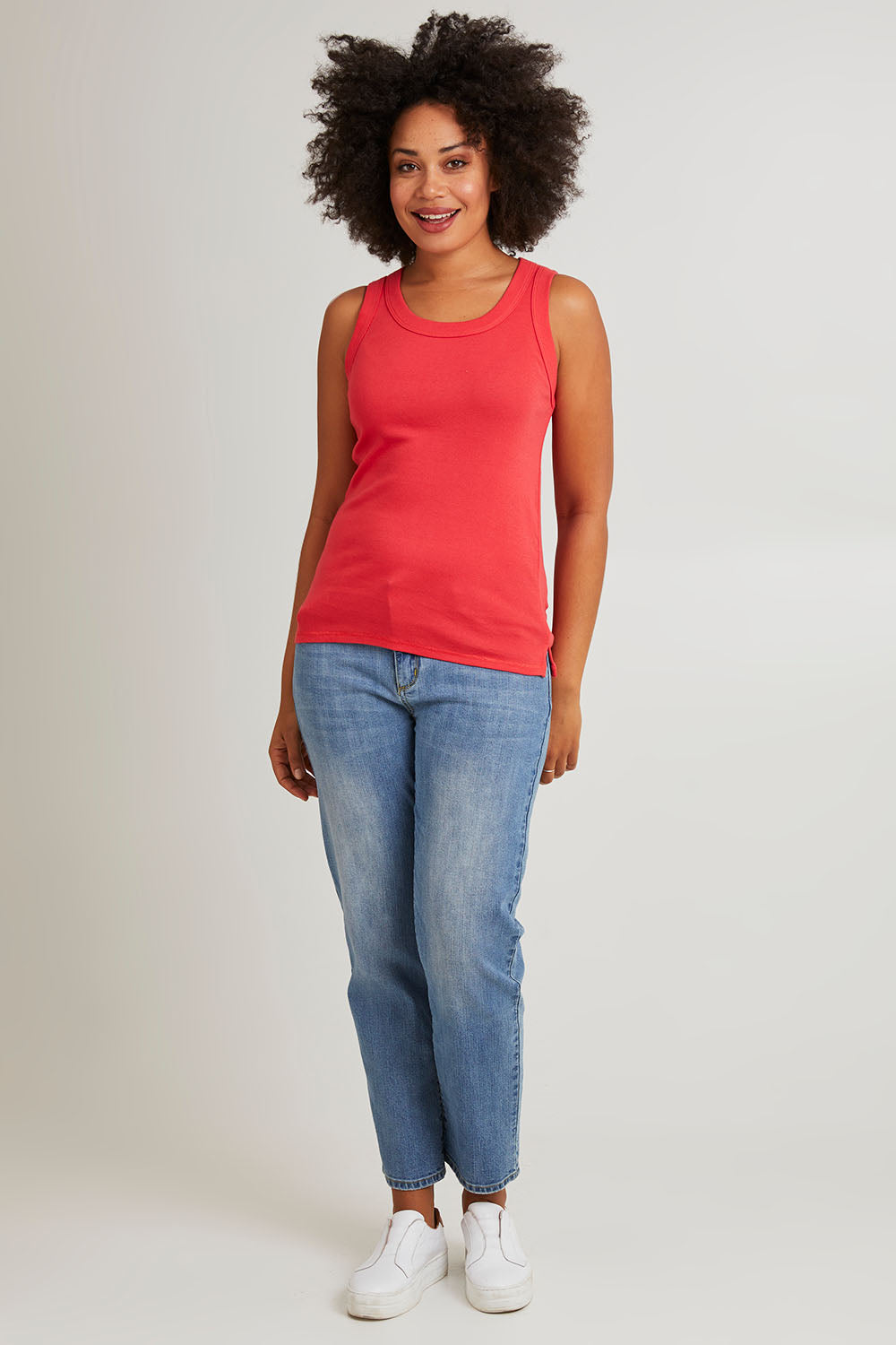 Model Olivia wearing size 10 of the Esme Cotton Tank in colour Cayenne (Red), from the front, showing the whole outfit
