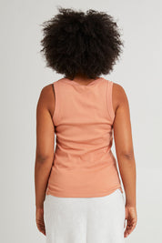 Model Olivia wearing size 10 of the Esme Cotton Tank in colour Clay, from the back