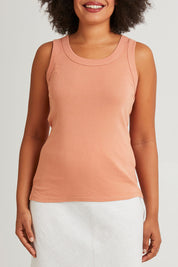 Model Olivia wearing size 10 of the Esme Cotton Tank in colour Clay, from the front, cropped image