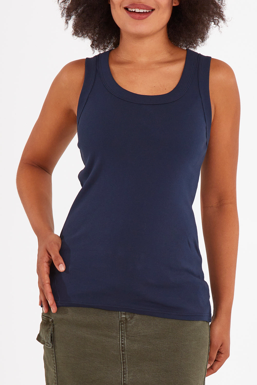 Model Olivia wearing size 10 of the Esme Cotton Tank in colour Sapphire (Blue), from the front, cropped image