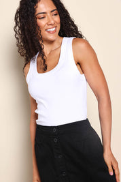 Model Pamelar wearing size 10 of the Esme Cotton Tank - White in colour White, in a cropped view