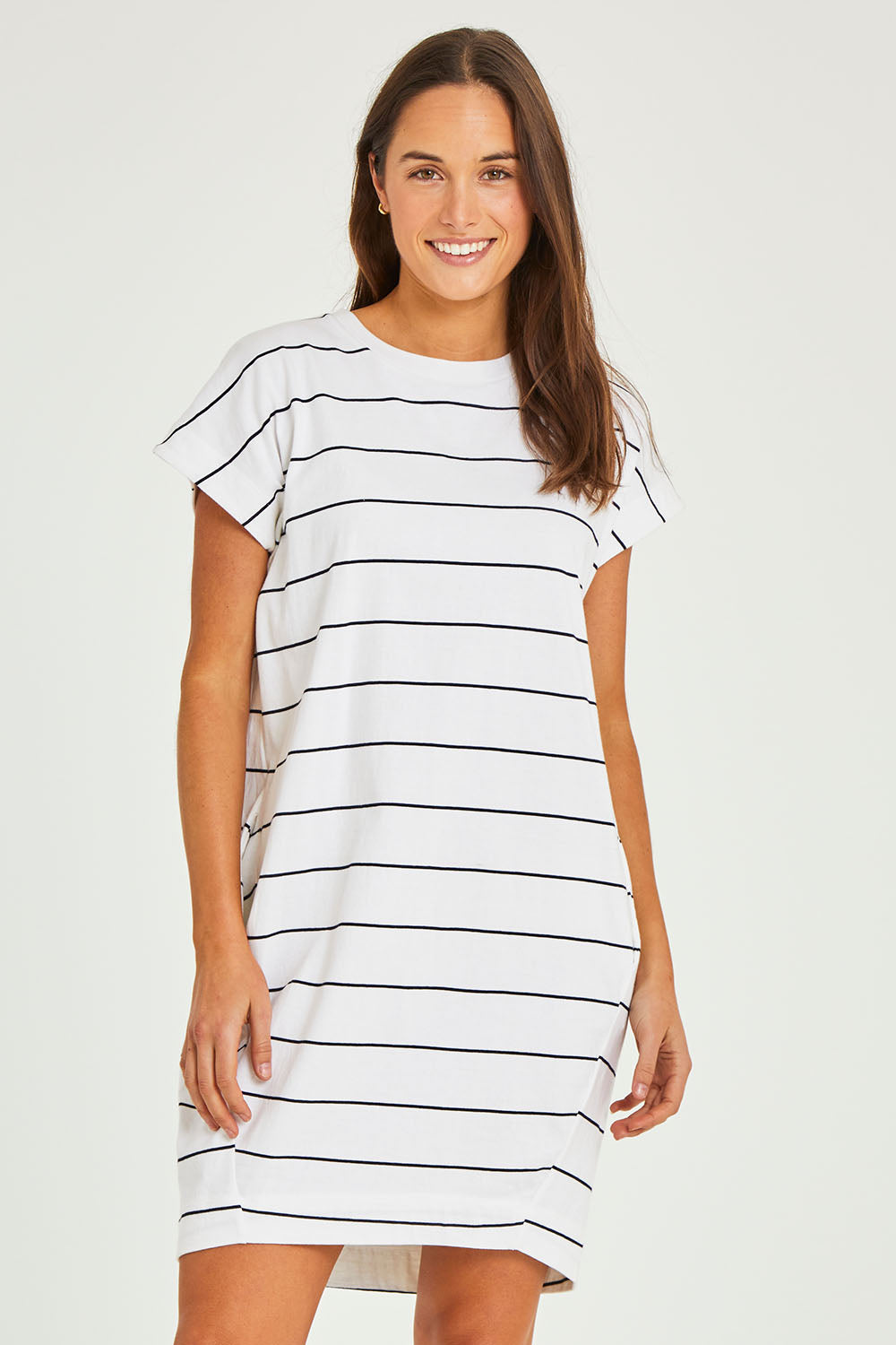 Model Elhana wearing size 10 of the Sunset Cove Stripe Dress in colour Whitenavy (White), from the front, cropped image