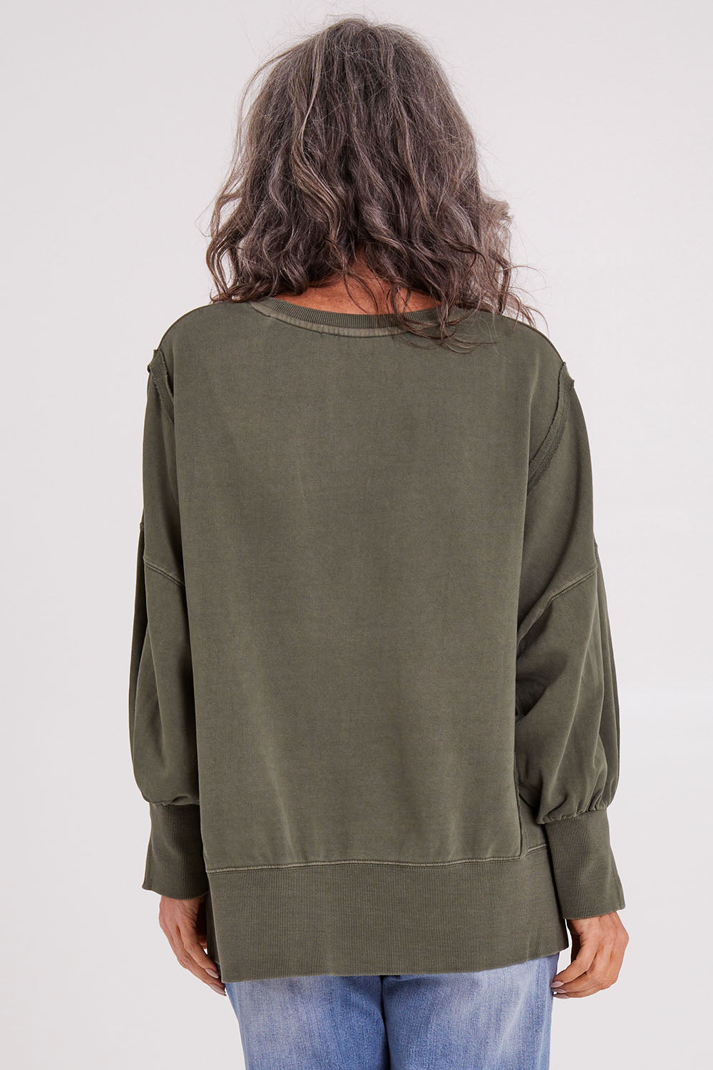 Model Luisa wearing size 10 of the Oversized Crew in colour Khaki (Green), from the back