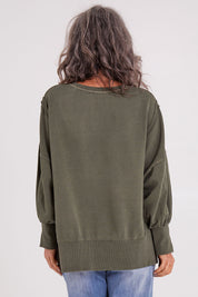 Model Luisa wearing size 10 of the Oversized Crew in colour Khaki (Green), from the back