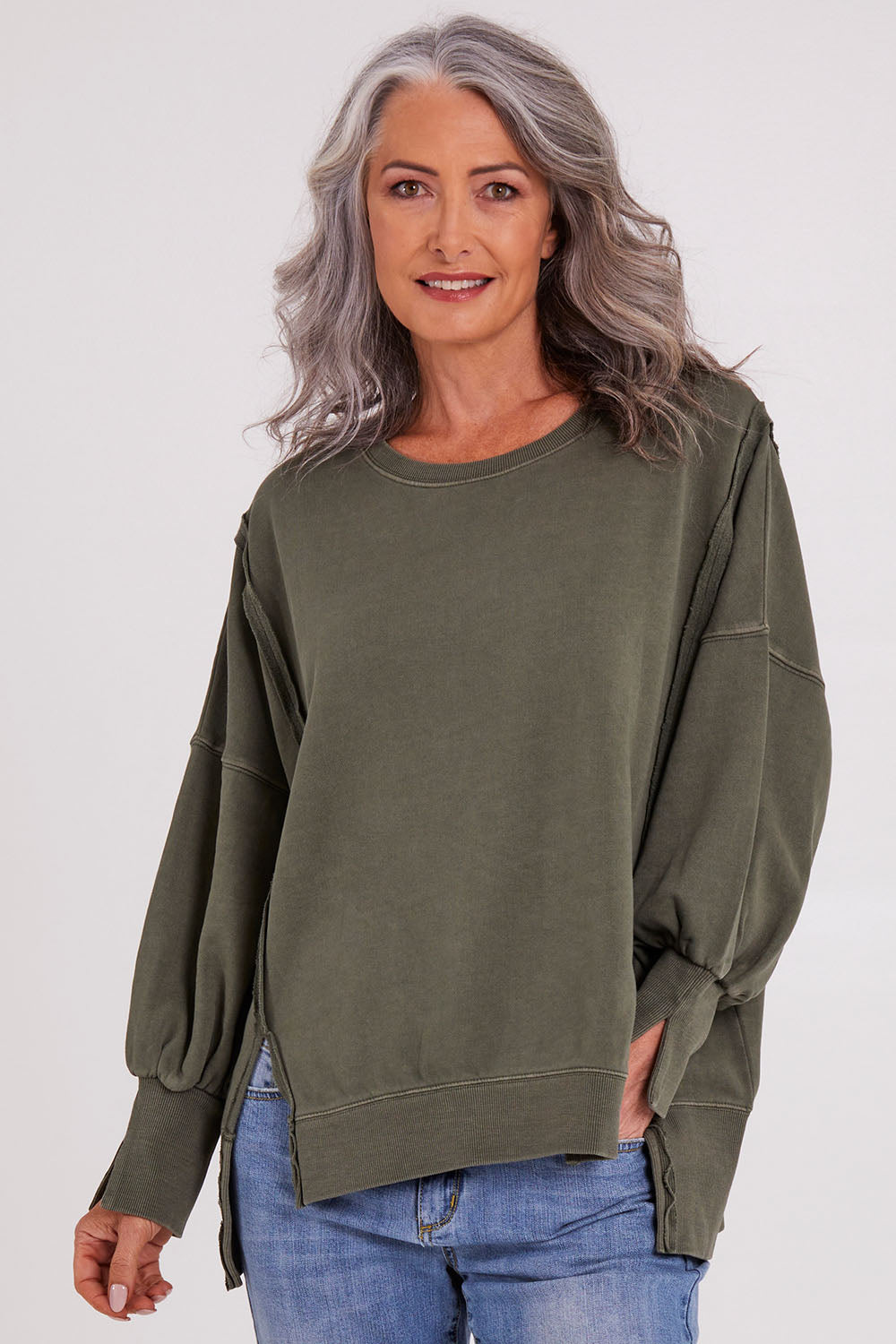 Model Luisa wearing size 10 of the Oversized Crew in colour Khaki (Green), from the front, cropped image