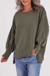 Model Luisa wearing size 10 of the Oversized Crew in colour Khaki (Green), from the front, cropped image