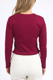 A model wearing the Elements Scoop Rib Cotton Blend  Long Sleeve in colour Beetroot (Red), from the back