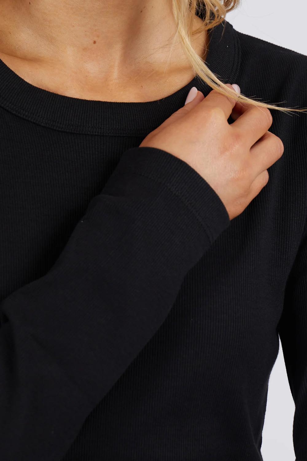 A model wearing the Elements Scoop Rib Cotton Blend  Long Sleeve in colour Black (Black), from the front, cropped image