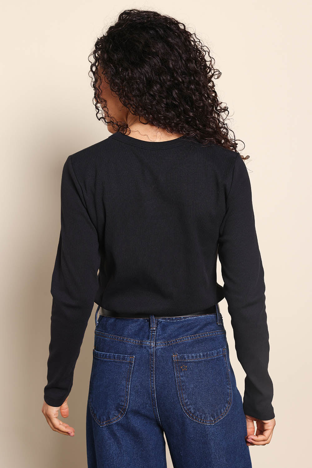 Model Pamelar wearing size 10 of the Elements Scoop Rib Cotton Blend  Long Sleeve - Black in colour Black, from the back