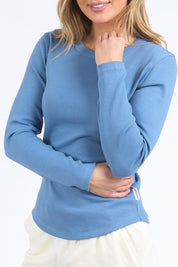 A model wearing the Elements Scoop Rib Cotton Blend  Long Sleeve in colour Coronetblu (Red), from the front, cropped image