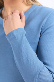 A model wearing the Elements Scoop Rib Cotton Blend  Long Sleeve in colour Coronetblu (Red), from the front, cropped image