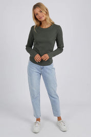 A model wearing the Elements Scoop Rib Cotton Blend  Long Sleeve in colour Khaki (Green), from the front, showing the whole outfit