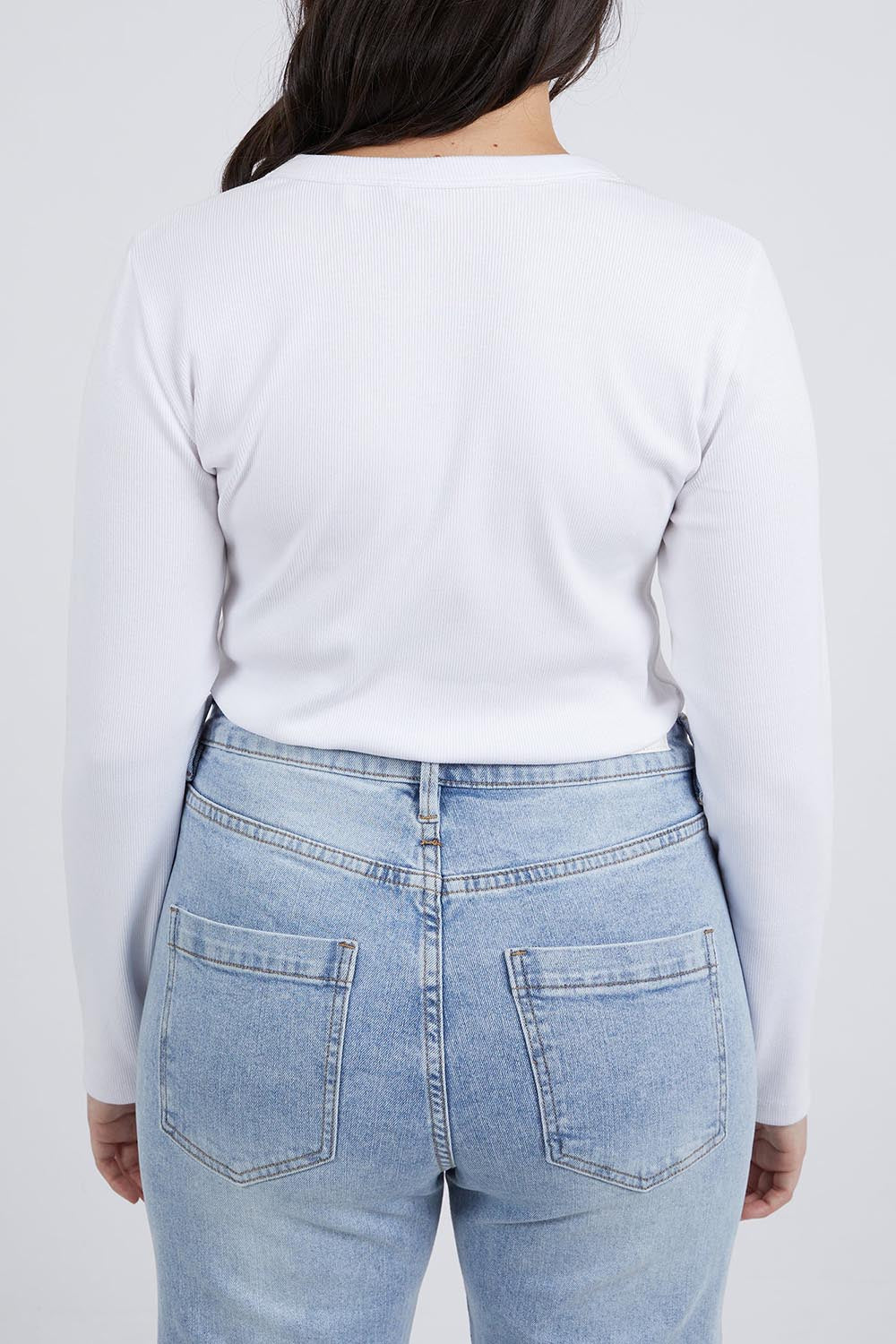 A model wearing the Elements Scoop Rib Cotton Blend  Long Sleeve in colour White (White), from the back