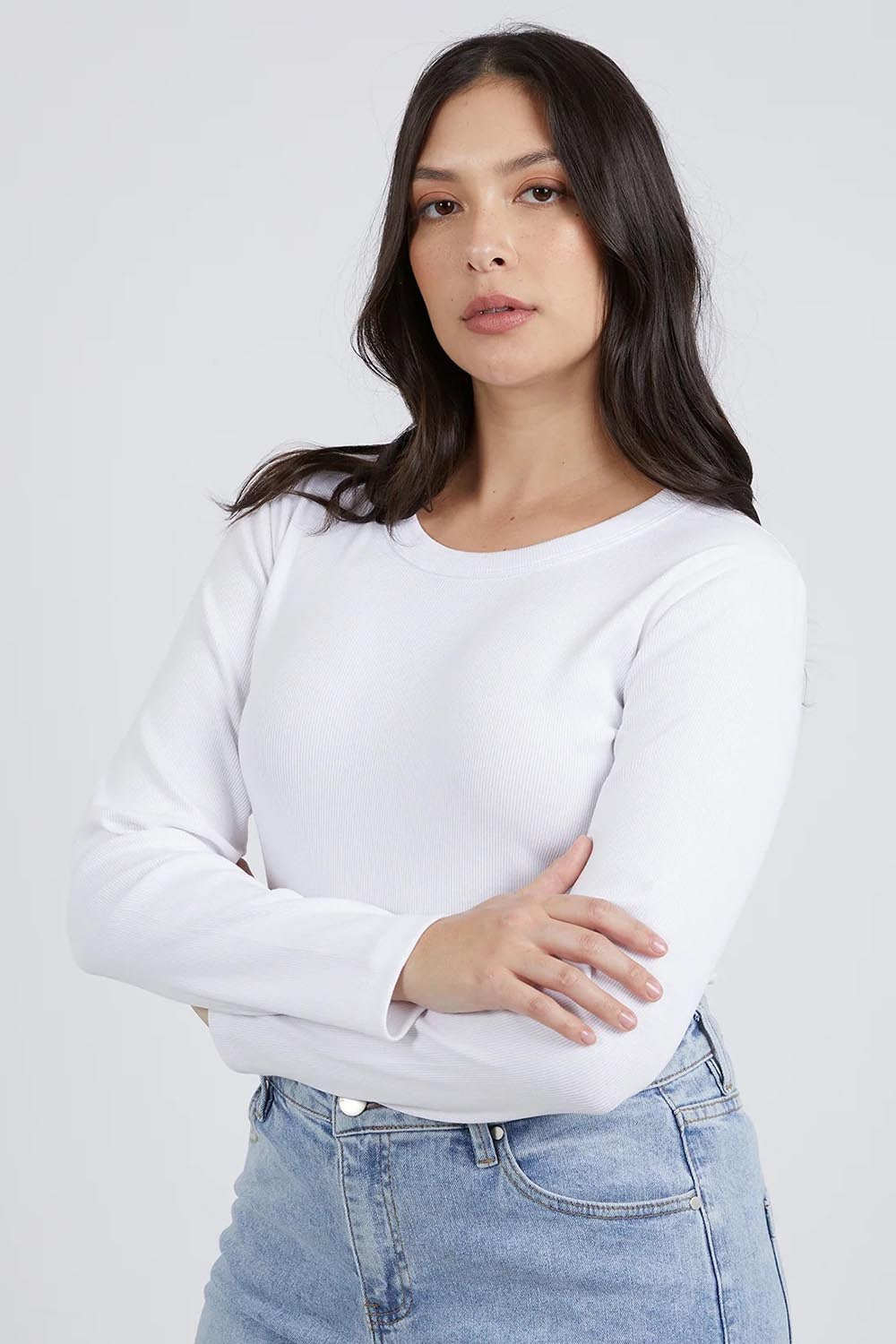 A model wearing the Elements Scoop Rib Cotton Blend  Long Sleeve in colour White (White), from the front, cropped image