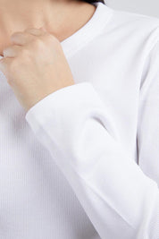 A model wearing the Elements Scoop Rib Cotton Blend  Long Sleeve in colour White (White), from the front, cropped image