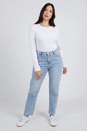A model wearing the Elements Scoop Rib Cotton Blend  Long Sleeve in colour White (White), from the front, showing the whole outfit
