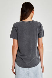 Model Madeline wearing size 10 of the Bouquet Tee in colour Black (Black), from the back