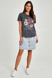 Model Madeline wearing size 10 of the Bouquet Tee in colour Black (Black), from the front, showing the whole outfit