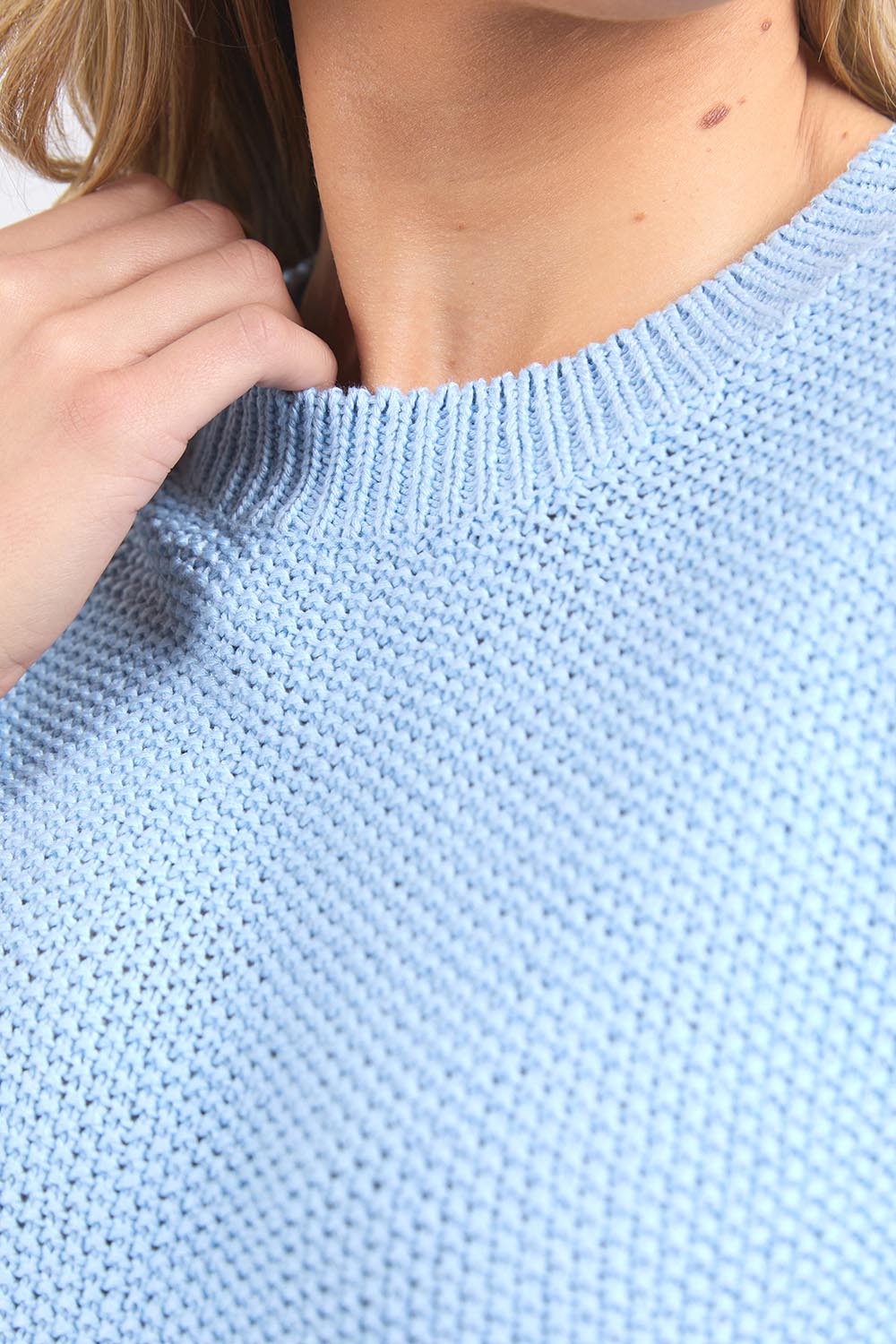 A model wearing the Blair Short Sleeve Cotton Knit in colour Cascadeblu (Blue), from the front, cropped image