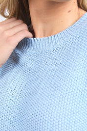 A model wearing the Blair Short Sleeve Cotton Knit in colour Cascadeblu (Blue), from the front, cropped image