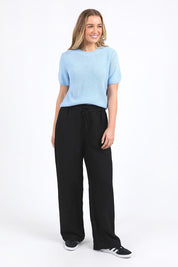 A model wearing the Blair Short Sleeve Cotton Knit in colour Cascadeblu (Blue), from the front, showing the whole outfit