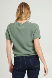 Model Grace wearing size 10 of the Blair Short Sleeve Cotton Knit in colour Sage Green (Green), from the back
