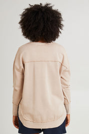 Model Grace wearing size 10 of the Leisure Medalion Crew in colour Oatmeal, from the back