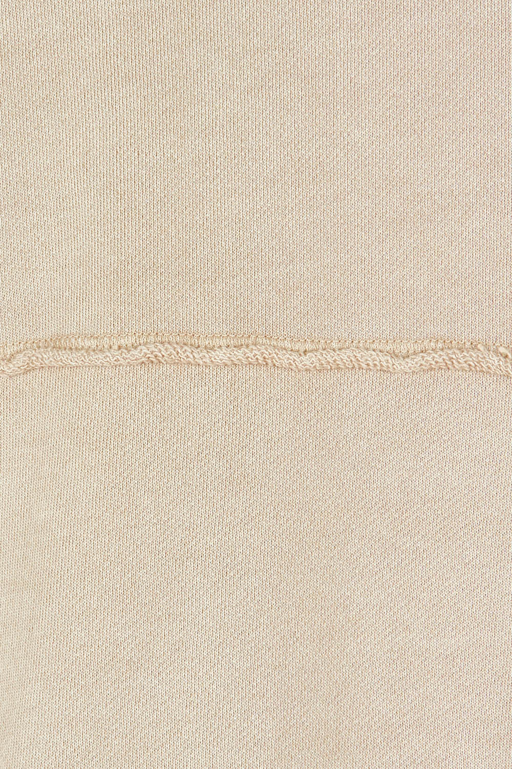 Product shot of the Leisure Medalion Crew in colour Oatmeal, detail