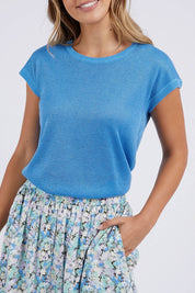 A model wearing the Alma Metallic Knit in colour Azureblue (Blue), from the front, cropped image