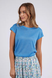 A model wearing the Alma Metallic Knit in colour Azureblue (Blue), from the front, cropped image
