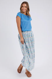 A model wearing the Alma Metallic Knit in colour Azureblue (Blue), from the front, showing the whole outfit