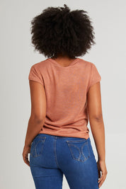 Model Olivia wearing size 10 of the Alma Metallic Knit in colour Clay, from the back