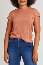 Model Olivia wearing size 10 of the Alma Metallic Knit in colour Clay, from the front, cropped image