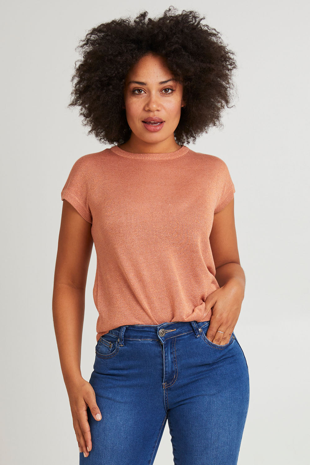 Model Olivia wearing size 10 of the Alma Metallic Knit in colour Clay, from the front, cropped image