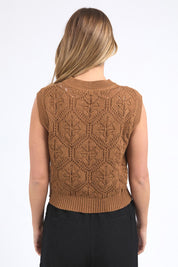 A model wearing the Luna Cotton Knit Vest in colour Toastcocon, from the back