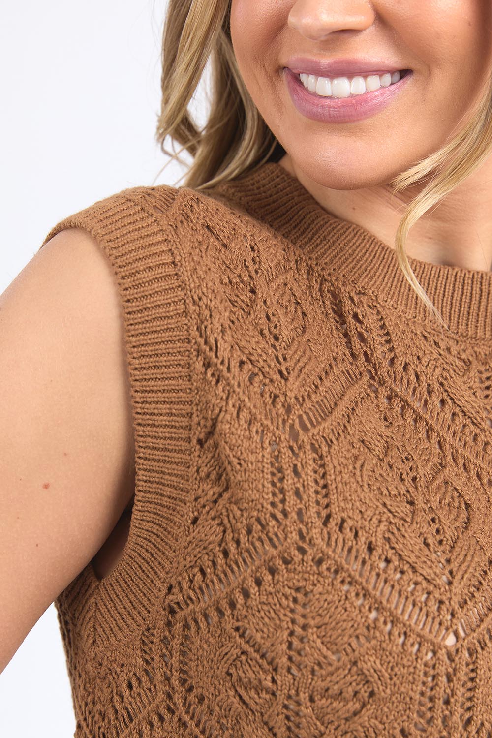 A model wearing the Luna Cotton Knit Vest in colour Toastcocon, from the front, cropped image