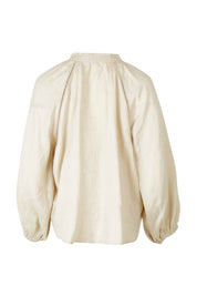 Product shot of the Sardina Blouse in colour Bone, from the back