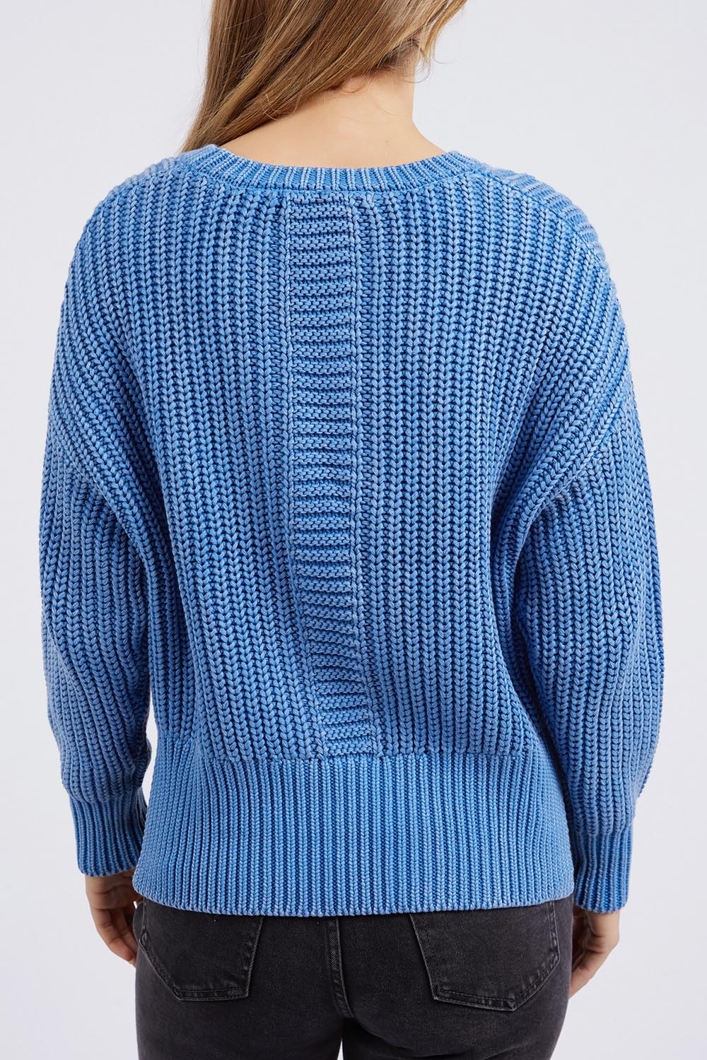 A model wearing the Winnie Knit Crew in colour Dukeblue (Blue), from the back