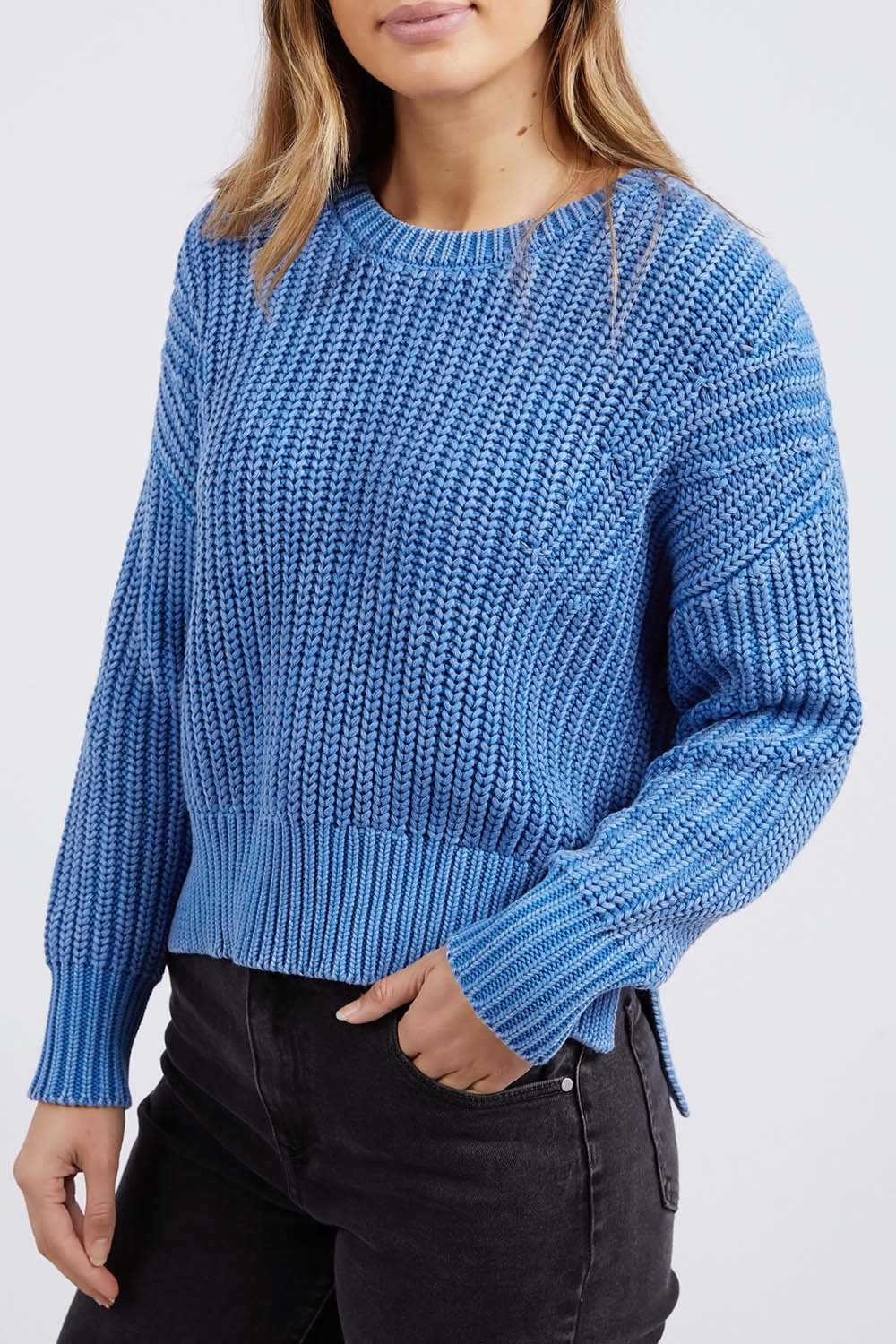 A model wearing the Winnie Knit Crew in colour Dukeblue (Blue), from the front, cropped image