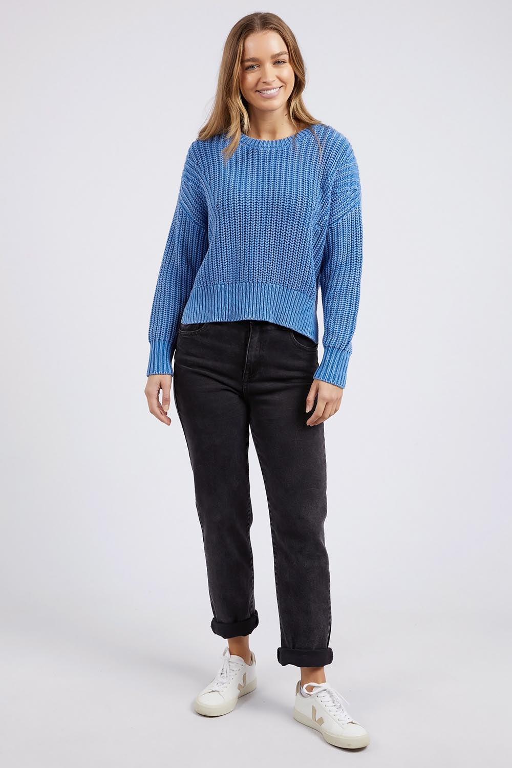 A model wearing the Winnie Knit Crew in colour Dukeblue (Blue), from the front, showing the whole outfit