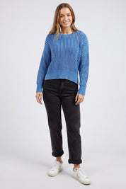 A model wearing the Winnie Knit Crew in colour Dukeblue (Blue), from the front, showing the whole outfit