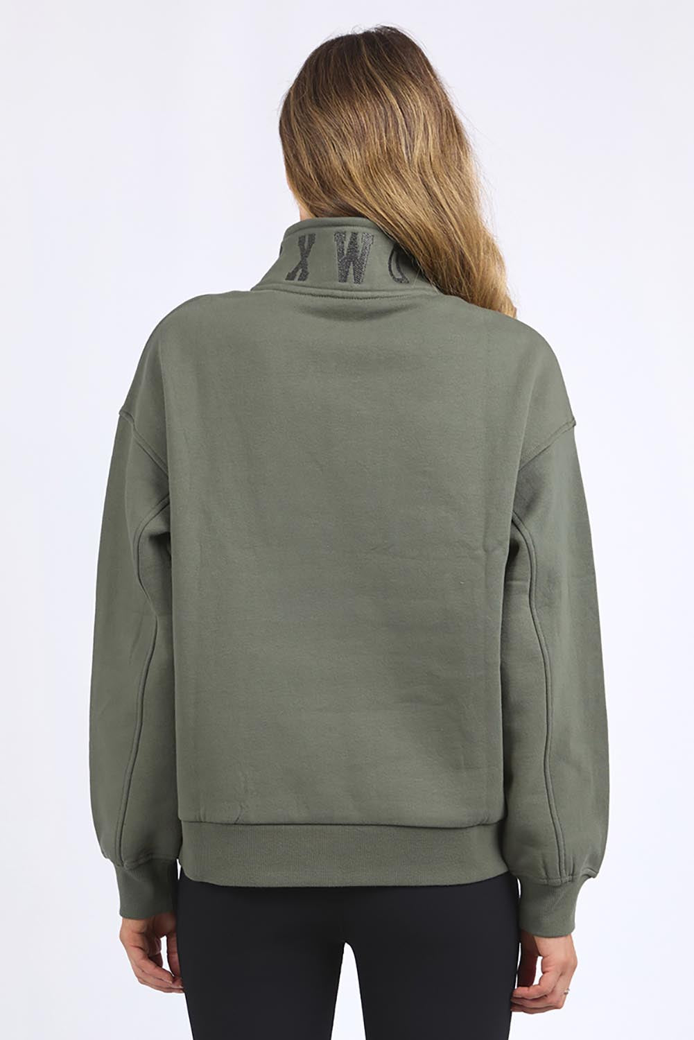 A model wearing the Elements College Zip Crew in colour Khaki (Green), from the back