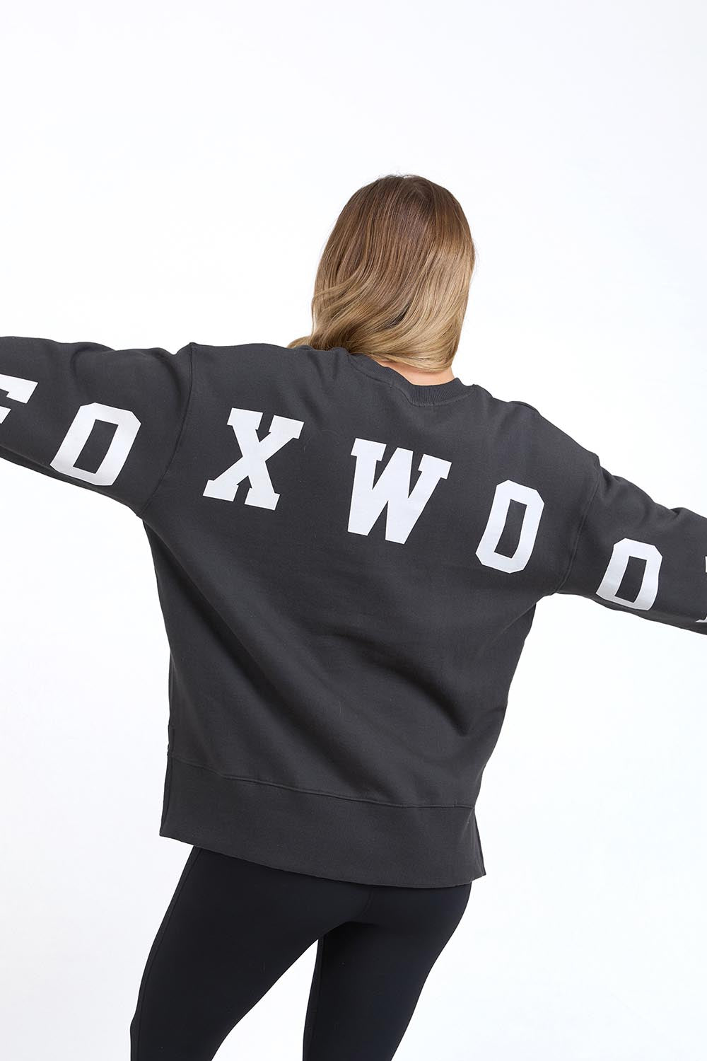 A model wearing the Interval Cotton Crew in colour Darkgrey (Grey), from the back